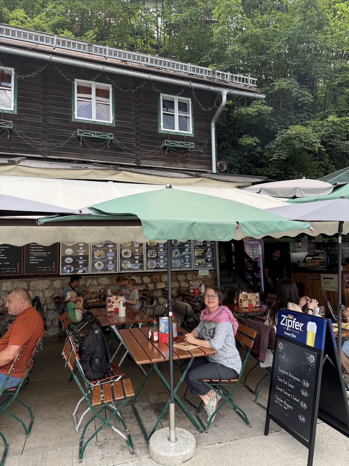 Umbrella-covered terrace and Schirmbar Hallstatt food counter